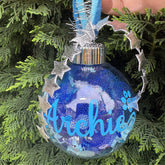 Decorative ornament with 'Archie' on a tree